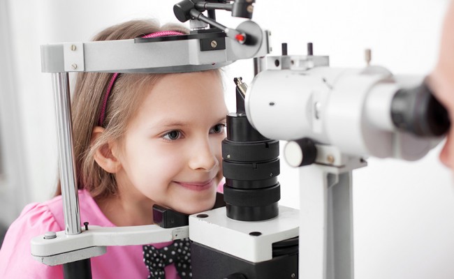 Optometrist performing visual field test